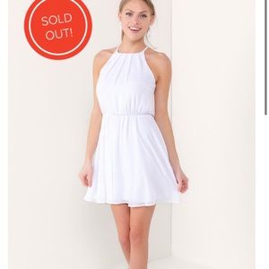 Francesca’s “flawless solid dress in white”